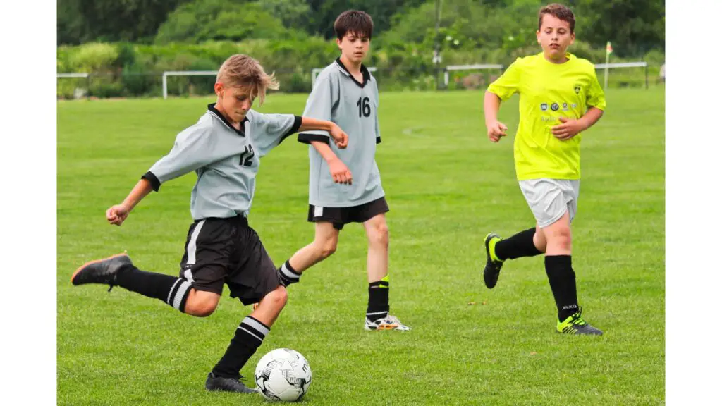 Is 17 too late to become a footballer - Youth player striking the ball