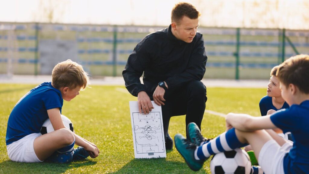 Winger Position In Soccer -A coach talking to his players