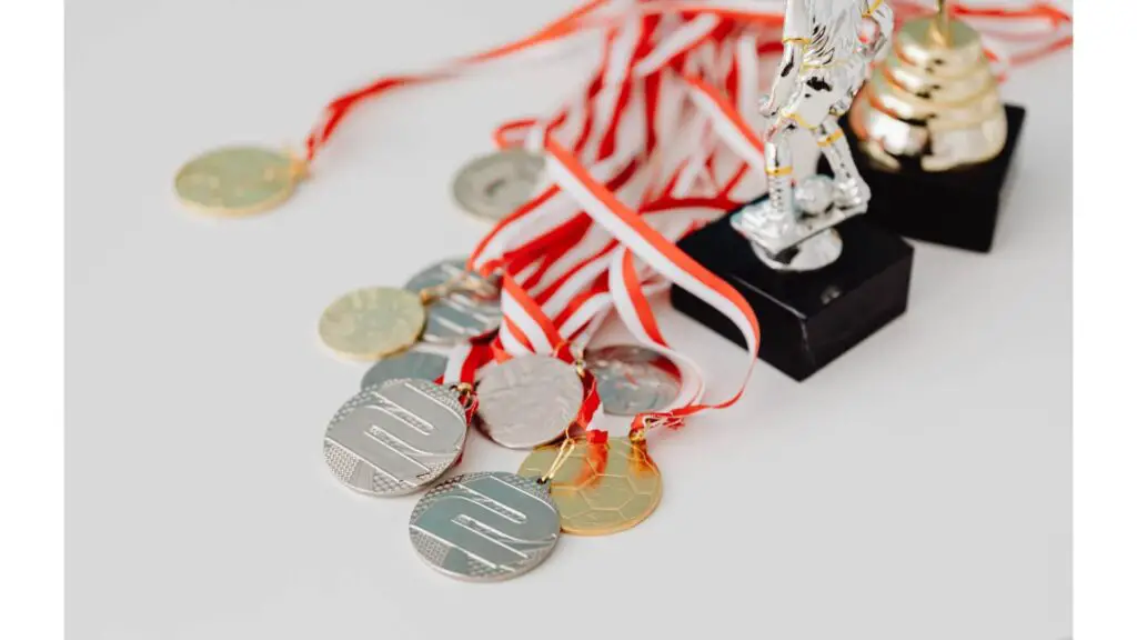 Why do football players take off their medals - Several medals
