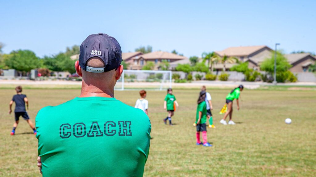 Where is the weakest soccer player - A soccer coach watching his players