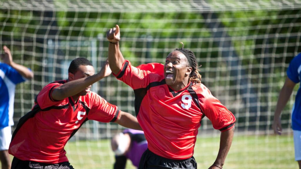 What is the role of a forward in soccer - a player celebrating a goal