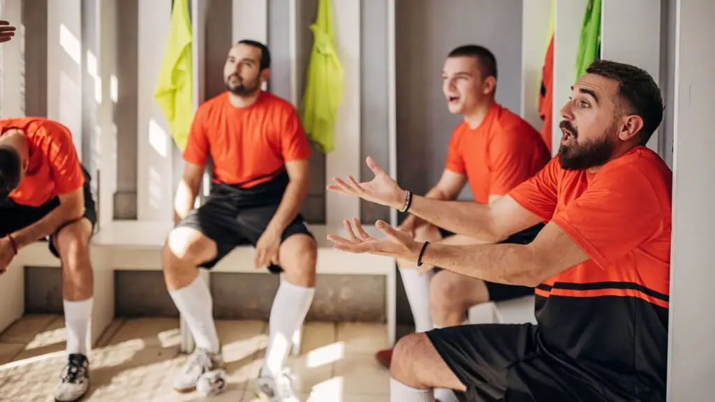 Importance of communication in soccer - Soccer players communicating in dressing room