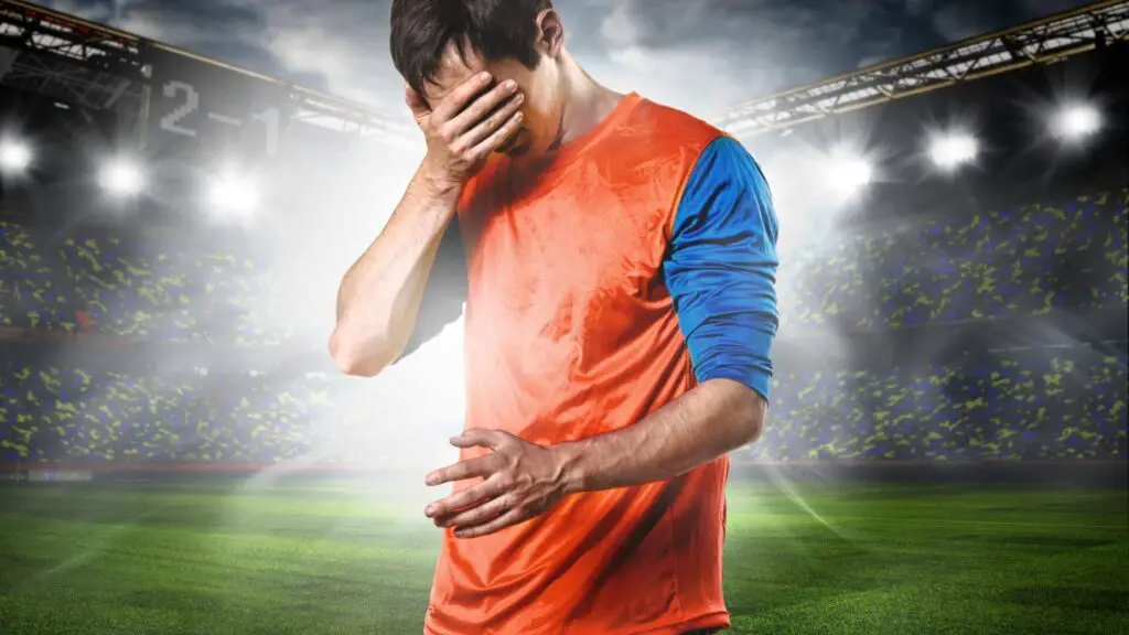 How to gain confidence in soccer - A player disappointed and putting his hand on his face