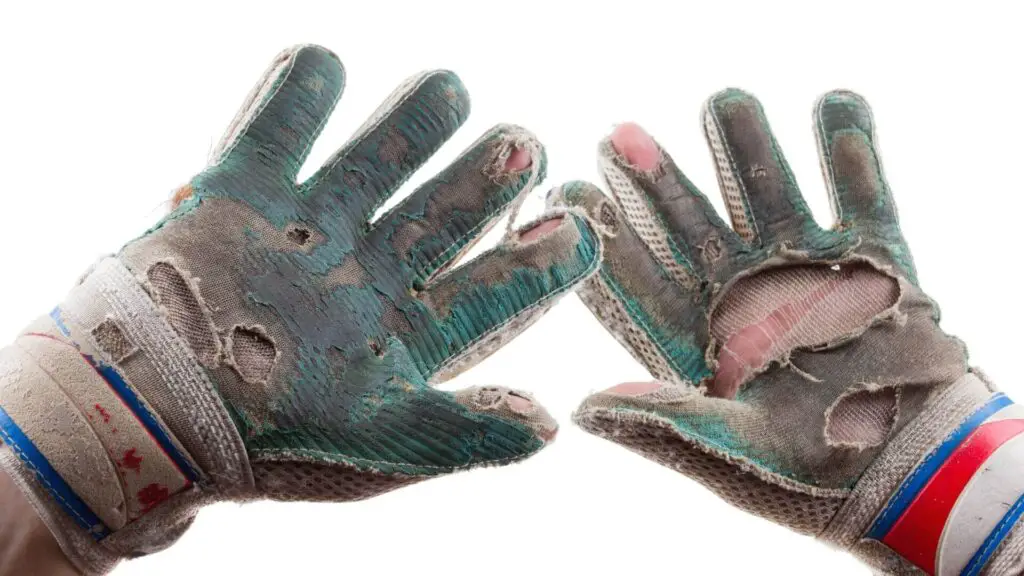 What do you do with old goalkeeper gloves - an old dirty soccer goalkeeper glove with holes