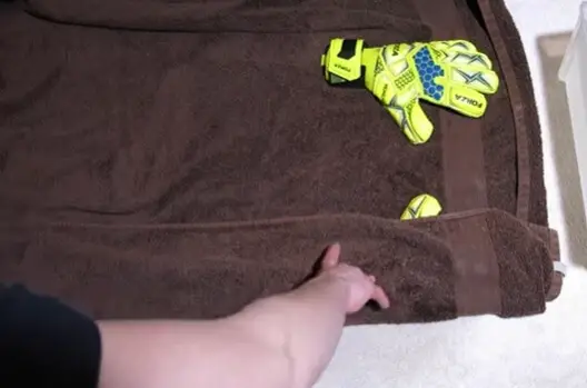 How to wash goalkeeper gloves - a pair of gloves in a towel