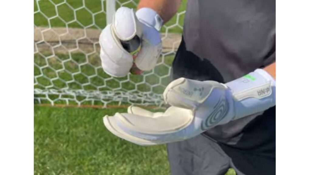 Do Professional Goalkeepers Use Glove Glu - A Goalkeepers spraying Glove Glu on his gloves