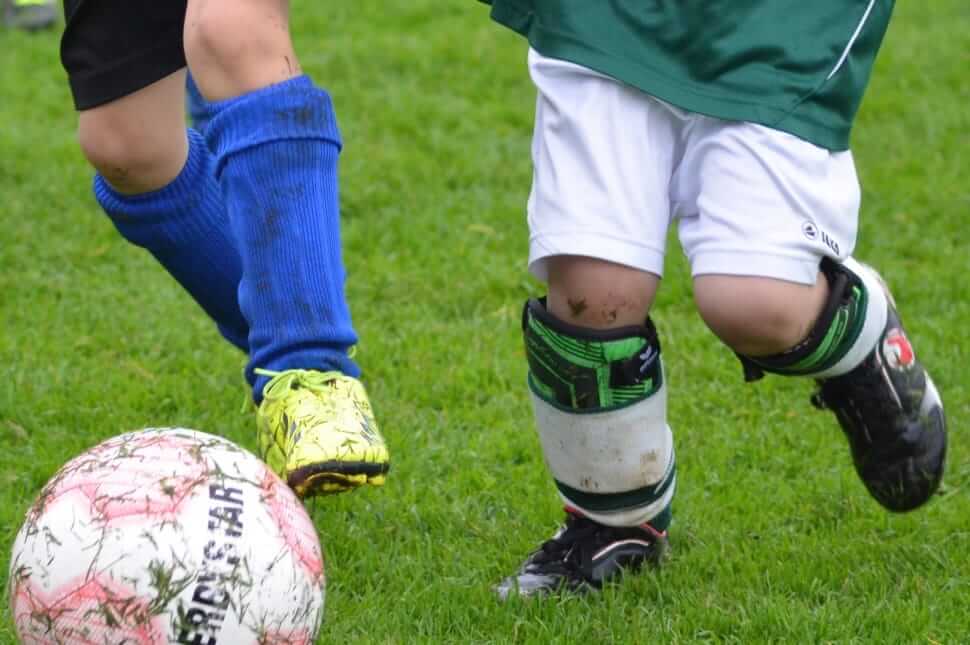 How to keep shin guards from smelling - Two players running for the ball