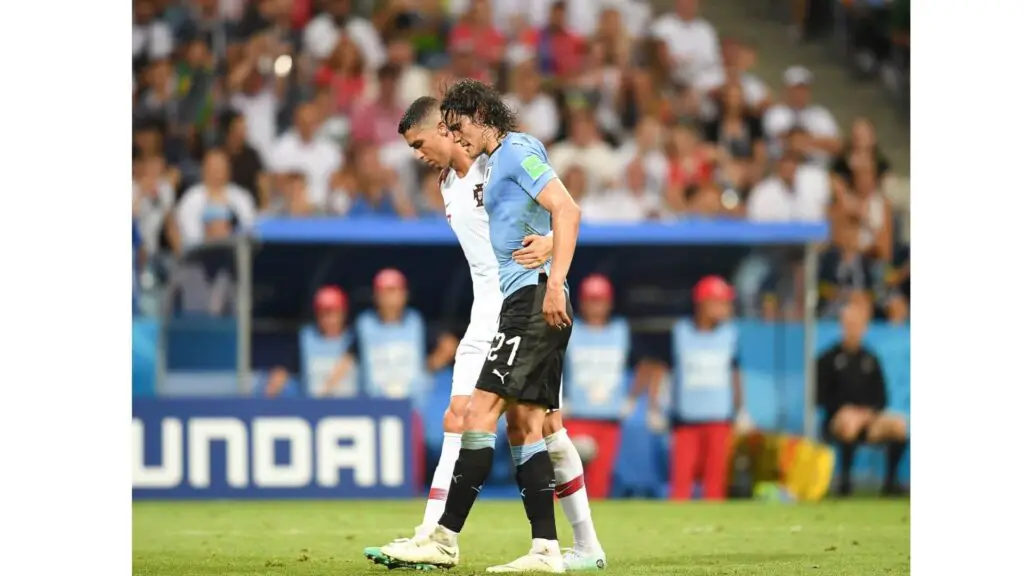 Sportsmanship in soccer/football - Portugal player helping Uruguay player get out of the pitch