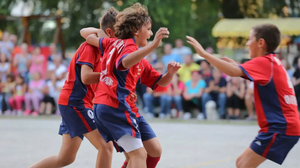 The importance of teamwork in soccer - Youth celebrating all together